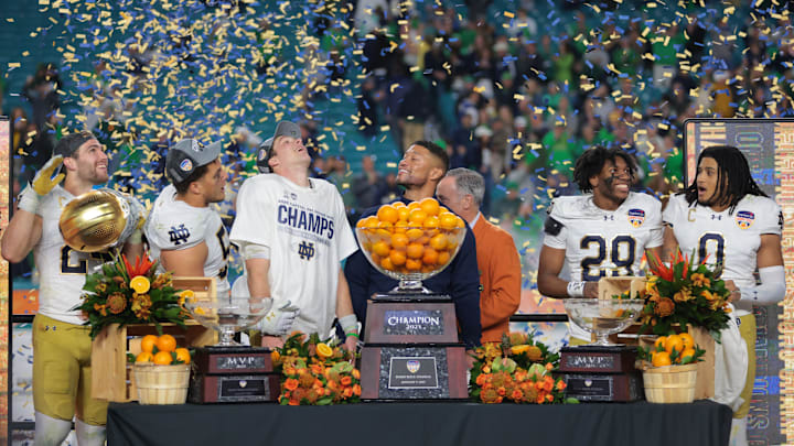 (EDITORS NOTE: caption correction) Jan 9, 2025; Miami, FL, USA; Notre Dame Fighting Irish head coach Marcus Freeman and quarterback Riley Leonard (13) celebrates defeating the Penn State Nittany Lions  in the Orange Bowl at Hard Rock Stadium.