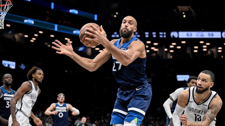 Nov 3, 2025; Brooklyn, New York, USA; Minnesota Timberwolves center Rudy Gobert (27) rebounds the ball against the Brooklyn Nets during the second half at Barclays Center. Mandatory Credit: John Jones-Imagn Images