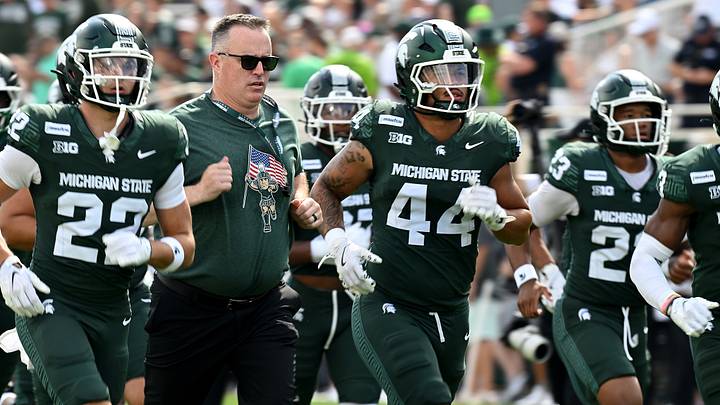 Sep 12, 2026; East Lansing, Michigan, USA; Michigan State Spartans head coach Pat Fitzgerald lrunswith his team before facing Eastern Michigan Eagles at Spartan Stadium. Mandatory Credit: Dale Young-Imagn Images Sep 12, 2026; East Lansing, Michigan, USA; Michigan State Spartans head coach Pat Fitzgerald lrunswith his team before facing Eastern Michigan Eagles at Spartan Stadium. Mandatory Credit: Dale Young-Imagn Images