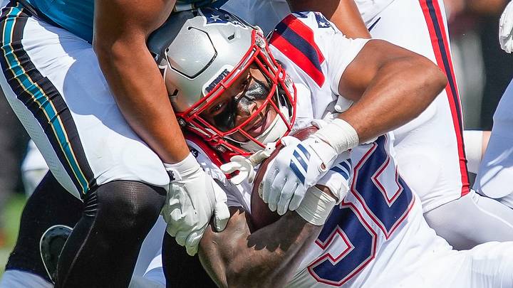 Jacksonville Jaguars defensive end Matt Dickerson (93) stops New England Patriots running back Treveyon Henderson (32) in the second quarter during an NFL football game at EverBank Stadium, Sunday, September 27, 2026, in Jacksonville, Fla. [Doug Engle/Florida Times-Union]