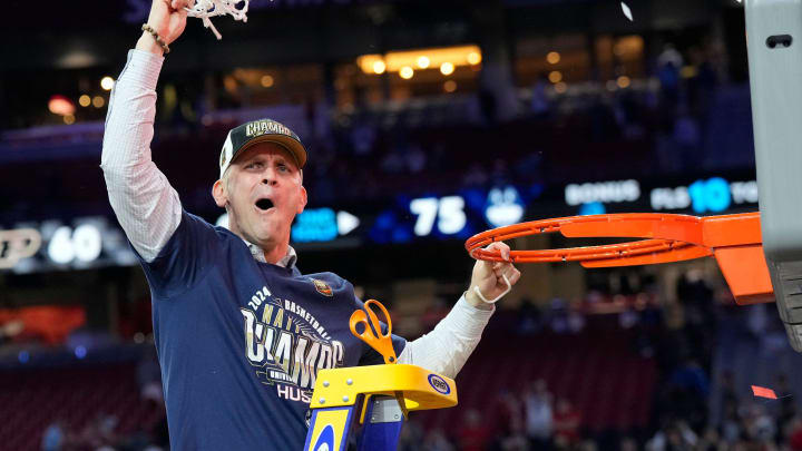 Connecticut Huskies head coach Dan Hurley cuts the basketball net winning the Men's NCAA national championship game against the Purdue Boilermakers at State Farm Stadium in Glendale on April 8, 2024.