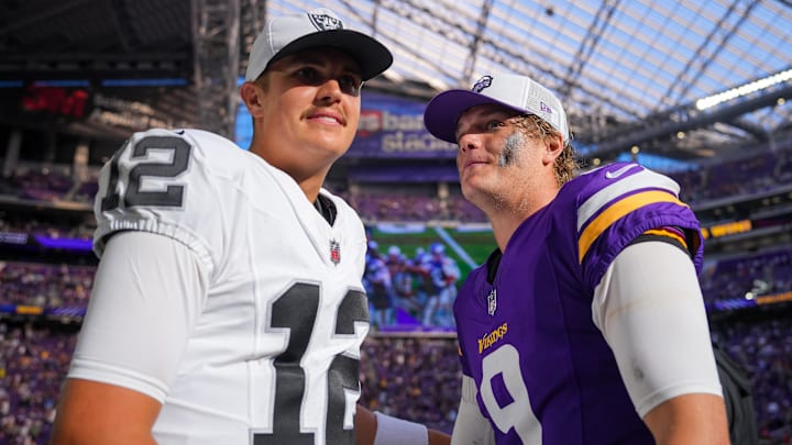 Aug 10, 2024; Minneapolis, Minnesota, USA; Minnesota Vikings quarterback J.J. McCarthy (9) and Las Vegas Raiders quarterback Aidan O'Connell (12) talk after the game at U.S. Bank Stadium. Mandatory Credit: Brad Rempel-Imagn Images