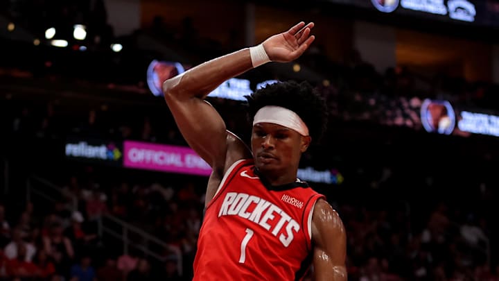 Apr 3, 2026; Houston, Texas, USA; Utah Jazz center Oscar Tshiebwe (34) handles the ball inside against Houston Rockets guard Amen Thompson (1) during the second quarter at Toyota Center. Mandatory Credit: Erik Williams-Imagn Images