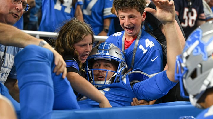 Detroit Lions quarterback Jared Goff (16) leaps into the crowd after a touchdown against the Chicago Bears Detroit Lions quarterback Jared Goff (16) leaps into the crowd after a touchdown against the Chicago Bears
