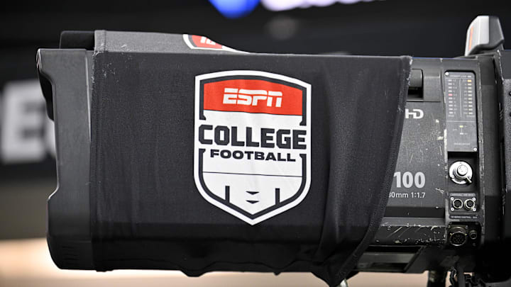 A view of a tv camera and the ESPN college football logo