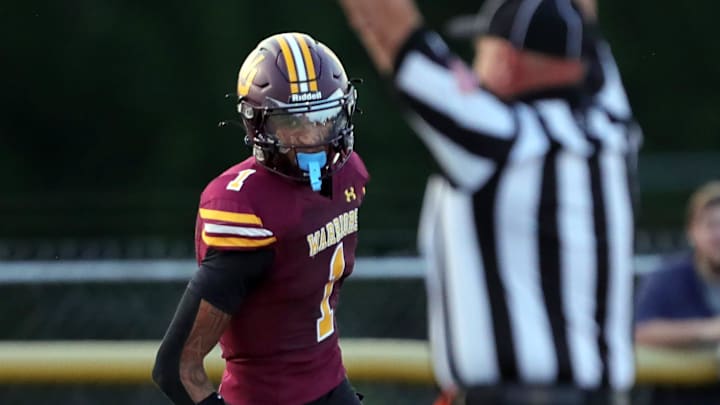 Walsh Jesuit wide receiver Milan Parris scores a touchdown against St. Ignatius during the first half of a high school football game, Friday, Sept. 13, 2024, in Cuyahoga Falls, Ohio.