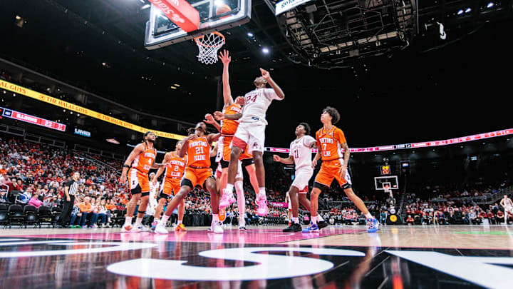 Nov 28, 2024; Kansas City, Missouri, USA; Illinois Fighting Illini center Tomislav Ivisic (13) puts up a shot around Arkansas Razorbacks forward Billy Richmond III (24) during the second half at T-Mobile Center. Mandatory Credit: William Purnell-Imagn Images