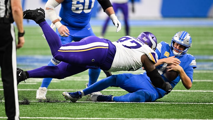 Nov 2, 2025; Detroit, Michigan, USA; Detroit Lions quarterback Jared Goff (16) is brought down by Minnesota Vikings defensive lineman Javon Hargrave (97) in the third quarter at Ford Field. Mandatory Credit: Lon Horwedel-Imagn Images