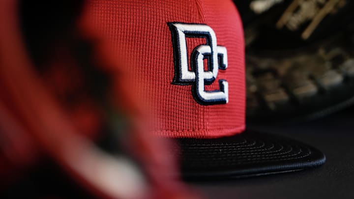Jul 11, 2025; Milwaukee, Wisconsin, USA;  General view of a Washington Nationals cap in the dugout during batting practice prior to the game against the Milwaukee Brewers at American Family Field. Mandatory Credit: Jeff Hanisch-Imagn Images