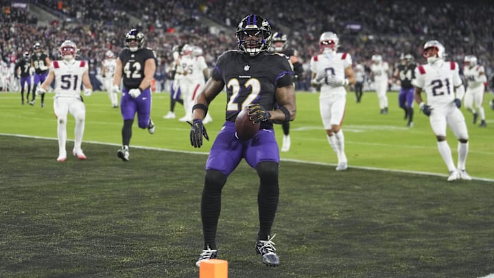 Dec 21, 2025; Baltimore, Maryland, USA;  Baltimore Ravens running back Derrick Henry (22) runs for a touchdown against the New England Patriots during the first quarter at M&T Bank Stadium. Mandatory Credit: Mitch Stringer-Imagn Images