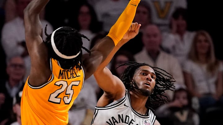 Vanderbilt forward Devin McGlockton (99) battles for the ball with Missouri guard Mark Mitchell (25) and guard Anthony Robinson II (0) during the second half at Memorial Gym in Nashville, Tenn., Saturday, March 1, 2025. Vanderbilt forward Devin McGlockton (99) battles for the ball with Missouri guard Mark Mitchell (25) and guard Anthony Robinson II (0) during the second half at Memorial Gym in Nashville, Tenn., Saturday, March 1, 2025.