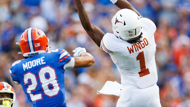 Oct 4, 2025; Gainesville, Florida, USA; Texas Longhorns wide receiver Ryan Wingo (1) attempts a catch over Florida Gators defensive back Devin Moore (28) during the second half at Ben Hill Griffin Stadium. Mandatory Credit: Matt Pendleton-Imagn Images Oct 4, 2025; Gainesville, Florida, USA; Texas Longhorns wide receiver Ryan Wingo (1) attempts a catch over Florida Gators defensive back Devin Moore (28) during the second half at Ben Hill Griffin Stadium. Mandatory Credit: Matt Pendleton-Imagn Images
