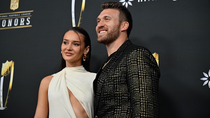 Kyle Juszczyk and his wife Kristin Juszczyk on the red carpet before the Super Bowl LIX NFL Honors ceremony.