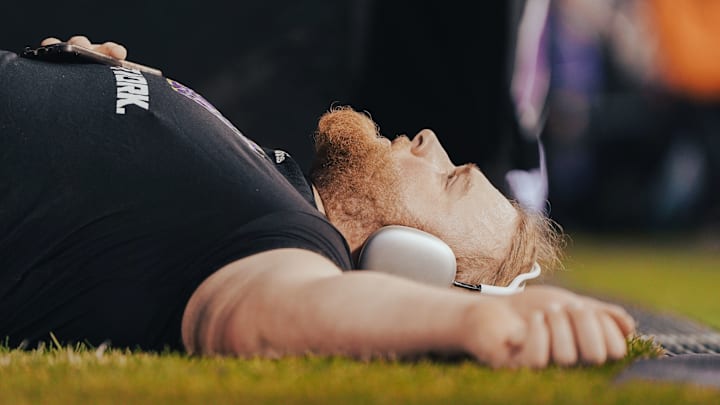 Landen Hatchett meditates before the Penn State game. 