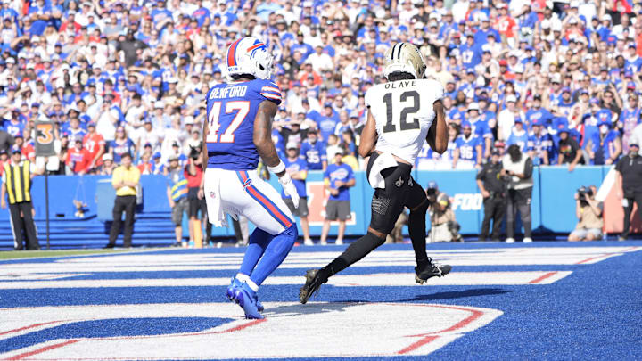 Sep 28, 2025; Orchard Park, New York, USA; New Orleans Saints wide receiver Chris Olave (12) runs in to the end zone for a touchdown past Buffalo Bills cornerback Christian Benford (47) Sep 28, 2025; Orchard Park, New York, USA; New Orleans Saints wide receiver Chris Olave (12) runs in to the end zone for a touchdown past Buffalo Bills cornerback Christian Benford (47)