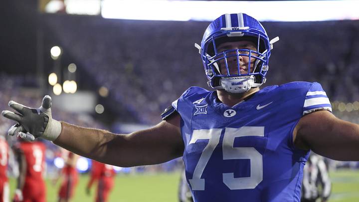 Oct 18, 2025; Provo, Utah, USA; BYU Cougars offensive lineman Andrew Gentry (75) reacts to a touchdown against the Utah Utes during the second half at LaVell Edwards Stadium. Mandatory Credit: Rob Gray-Imagn Images
