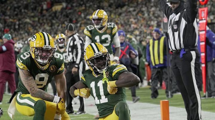 Green Bay Packers wide receiver Jayden Reed (11) celebrates his touchdown reception with wide receiver Christian Watson (9) against the Miami Dolphins.