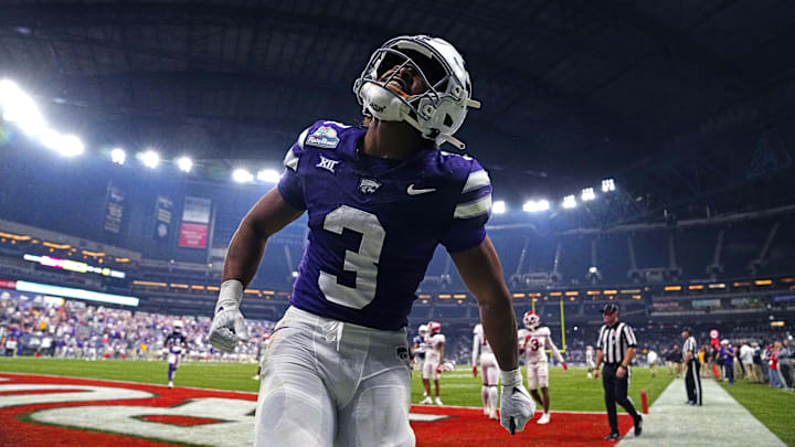 Kansas State running back Dylan Edwards (3) celebrates the go-ahead touchdown against Rutgers during the second half of the Rate Bowl at Chase Field on Dec. 26, 2024, in Phoenix. Kansas State running back Dylan Edwards (3) celebrates the go-ahead touchdown against Rutgers during the second half of the Rate Bowl at Chase Field on Dec. 26, 2024, in Phoenix.