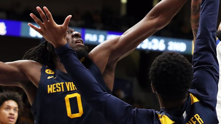 Nov 15, 2024; Pittsburgh, Pennsylvania, USA;  Pittsburgh Panthers guard Damian Dunn (1) shoots against West Virginia Mountaineers center Eduardo Andre (0) and guard KJ Tenner (3) during the second half at the Petersen Events Center. Mandatory Credit: Charles LeClaire-Imagn Images