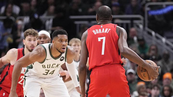 Nov 9, 2025; Milwaukee, Wisconsin, USA; Milwaukee Bucks forward Giannis Antetokounmpo (34) defends against Houston Rockets forward Kevin Durant (7) in the second half at Fiserv Forum. Mandatory Credit: Michael McLoone-Imagn Images