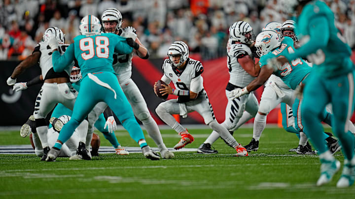 Cincinnati Bengals quarterback Joe Burrow (9) cuts right as he keeps the ball on a play in the second quarter of the NFL Week 4 game between the Cincinnati Bengals and the Miami Dolphins at PayCor Stadium in downtown on Thursday, Sept. 29, 2022. Cincinnati Bengals quarterback Joe Burrow (9) cuts right as he keeps the ball on a play in the second quarter of the NFL Week 4 game between the Cincinnati Bengals and the Miami Dolphins at PayCor Stadium in downtown on Thursday, Sept. 29, 2022.