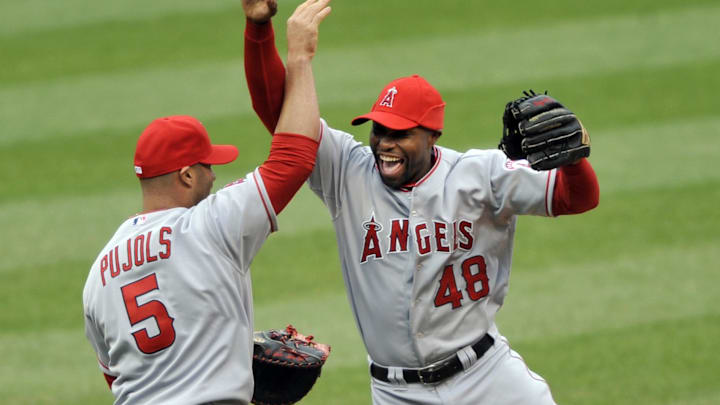 Apr 28, 2012; Cleveland, OH, USA; Los Angeles Angels right fielder Torii Hunter (48) and first baseman Albert Pujols (5) celebrate a 2-1 win over the Cleveland Indians at Progressive Field. Mandatory Credit: David Richard-Imagn Images Apr 28, 2012; Cleveland, OH, USA; Los Angeles Angels right fielder Torii Hunter (48) and first baseman Albert Pujols (5) celebrate a 2-1 win over the Cleveland Indians at Progressive Field. Mandatory Credit: David Richard-Imagn Images