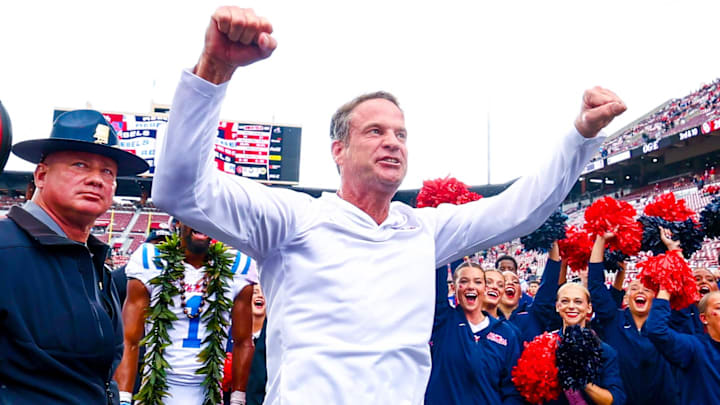 Oct 25, 2025; Norman, Oklahoma, USA;  Ole Miss Rebels head coach Lane Kiffin celebrates with fans after the game against the Oklahoma Sooners at Gaylord Family-Oklahoma Memorial Stadium. Mandatory Credit: Kevin Jairaj-Imagn Images