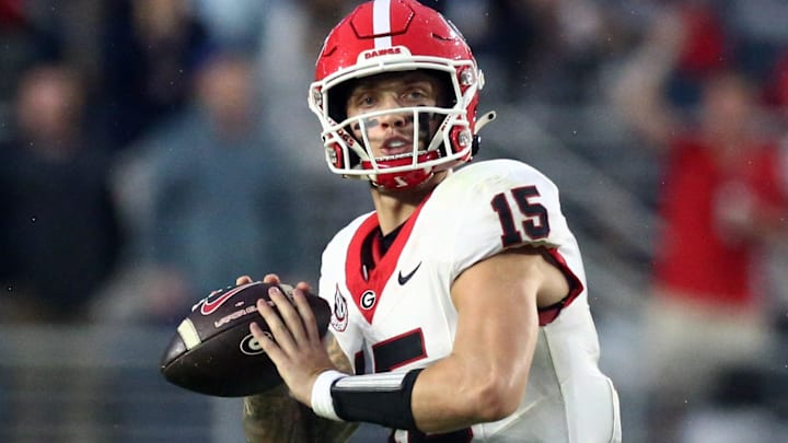 Georgia Bulldogs quarterback Carson Beck (15) passes the ball during the second half against the Mississippi Rebels. Georgia Bulldogs quarterback Carson Beck (15) passes the ball during the second half against the Mississippi Rebels.