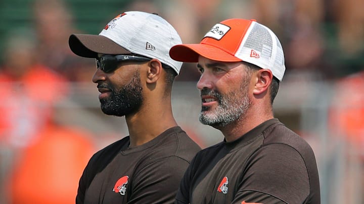 Browns GM Andrew Berry, left, and coach Kevin Stefanski watch practice in training camp, Saturday, July 31, 2021, in Berea.