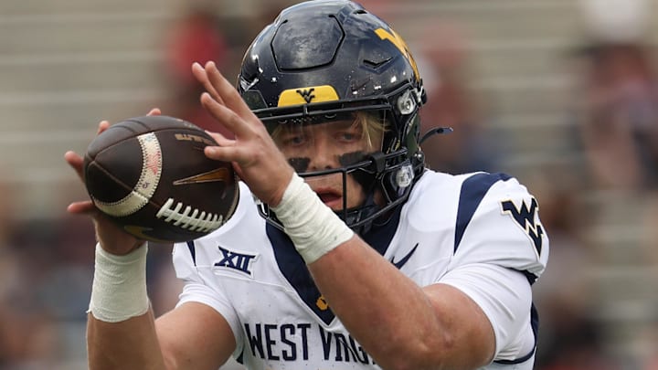 Nov 1, 2025; Houston, Texas, USA; West Virginia Mountaineers quarterback Scotty Fox Jr. (15) takes a snap against the Houston Cougars in the first half at TDECU Stadium. Mandatory Credit: Thomas Shea-Imagn Images Nov 1, 2025; Houston, Texas, USA; West Virginia Mountaineers quarterback Scotty Fox Jr. (15) takes a snap against the Houston Cougars in the first half at TDECU Stadium. Mandatory Credit: Thomas Shea-Imagn Images