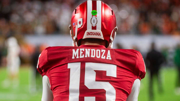 Indiana's Fernando Mendoza (15) gets loose before the College Football Playoff National Championship college football game at Hard Rock Stadium in Miami Gardens on Monday, Jan. 19, 2026.