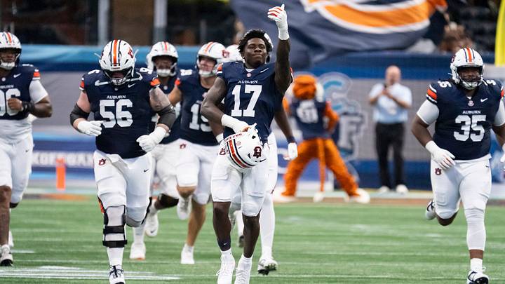 Auburn Tigers linebacker Xavier Atkins (17) pumps up the crowd as his team takes the field as Auburn Tigers take on Baylor Bears in the Aflac Kickoff Game at Mercedes-Benz Stadium in Atlanta, Ga. on Saturday, Sept. 5, 2026. Auburn Tigers defeated Baylor Bears 17-16.