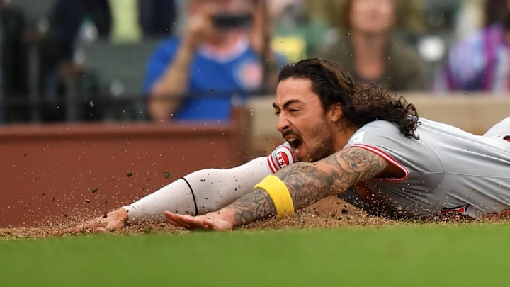 Sep 29, 2024; Chicago, Illinois, USA; Cincinnati Reds second base Jonathan India (6) slides into home plate during the tenth inning against the Chicago Cubs at Wrigley Field. Mandatory Credit: Patrick Gorski-Imagn Images