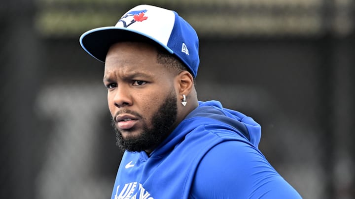 Feb 19, 2025; Dunedin, FL, USA; Toronto Blue Jays infielder Vladimir Guerrero Jr. (27) waits for the start of a drill during spring training at Cecil B. Englebert Complex. Feb 19, 2025; Dunedin, FL, USA; Toronto Blue Jays infielder Vladimir Guerrero Jr. (27) waits for the start of a drill during spring training at Cecil B. Englebert Complex.