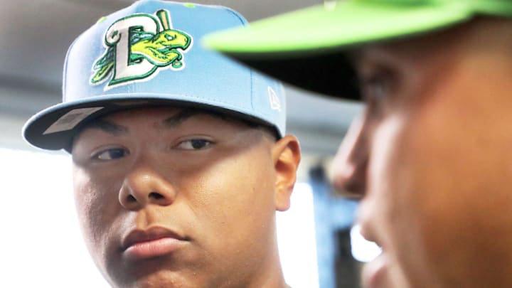 Daytona Tortugas catcher Alfredo Duno listens to manager Julio Morillo during an interview, as players arrive at Jackie Robinson Ballpark and get settled in the clubhouse, Wednesday, April 3, 2024.