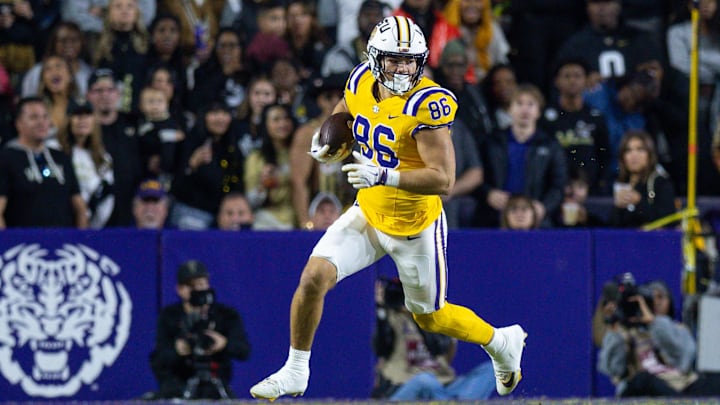 LSU Tigers tight end Mason Taylor (86) runs after a catch against the Vanderbilt Commodores during the first half at Tiger Stadium. 