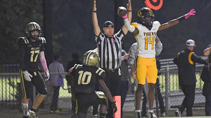 Crescent High sophomore Amiri Acker (14) scores near Pendleton junior Jemarai Johnson (10) during the second quarter at Cunningham Stadium in Pendleton, S.C. Friday, October 13, 2023.