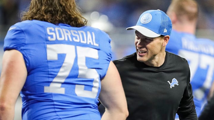 Detroit Lions offensive coordinator Ben Johnson shakes hands with rookie offensive lineman Colby Sorsdal (75) 