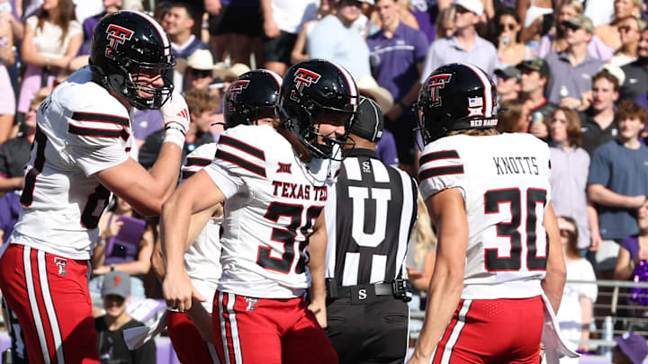 Texas Tech Red Raiders place kicker Reese Burkhardt (38) celebrates after running a trick play for a touchdown against the TCU Horned Frogs in the second quarter at Amon G. Carter Stadium. Texas Tech Red Raiders place kicker Reese Burkhardt (38) celebrates after running a trick play for a touchdown against the TCU Horned Frogs in the second quarter at Amon G. Carter Stadium.