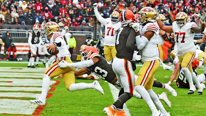 Nov 30, 2025; Cleveland, Ohio, USA;  San Francisco 49ers quarterback Brock Purdy (13) scores a touchdown during the second half against the Cleveland Browns at Huntington Bank Field. Mandatory Credit: Ken Blaze-Imagn Images