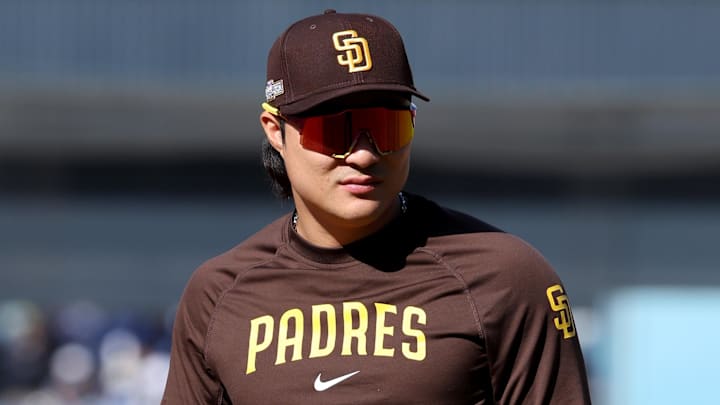 Oct 6, 2024; Los Angeles, California, USA; San Diego Padres shortstop Ha-Seong Kim (7) looks on during warm ups before game two against the Los Angeles Dodgers in the NLDS for the 2024 MLB Playoffs at Dodger Stadium. 