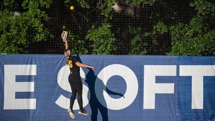 A home run ball flies over the head of Missouri Tigers outfielder Alex Honnold (25) during the SEC softball tournament championship game at Jane B. Moore Field in Auburn, Ala., on Saturday, May 11, 2024. Florida Gators defeated Missouri Tigers 6-1.