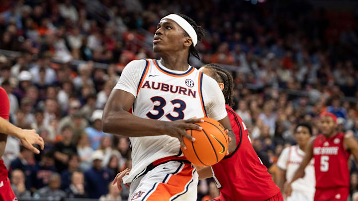 Auburn Tigers forward Sebastian Williams-Adams (33) drives the ball as Auburn Tigers take on NC State Wolfpack at Neville Arena in Auburn, Ala. on Wednesday, Dec. 3, 2025. Auburn Tigers defeated NC State Wolfpack 83-73.