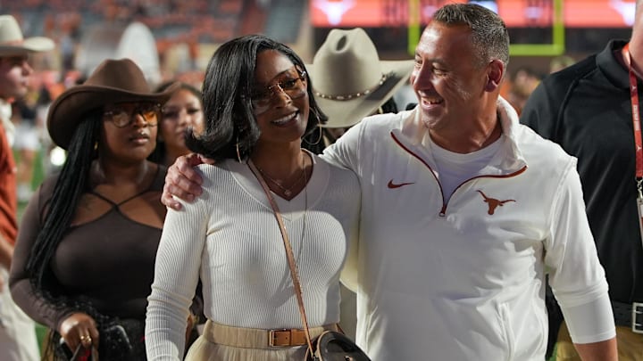 Texas Longhorns head coach Steve Sarkisian and his wife Loreal Sarkisian walk off the field after defeating the Kentucky Wildcats at Darrell K Royal Texas Memorial Stadium. Texas Longhorns head coach Steve Sarkisian and his wife Loreal Sarkisian walk off the field after defeating the Kentucky Wildcats at Darrell K Royal Texas Memorial Stadium.