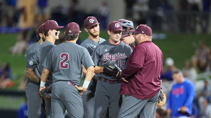 Texas A&M has a mound conference during an NCAA baseball game against the Florida Gators.
