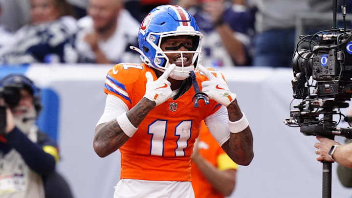 Oct 26, 2025; Denver, Colorado, USA;  Denver Broncos wide receiver Troy Franklin (11) celebrates after scoring a touchdown against the Dallas Cowboys in the fourth quarter at Empower Field at Mile High. Mandatory Credit: Ron Chenoy-Imagn Images