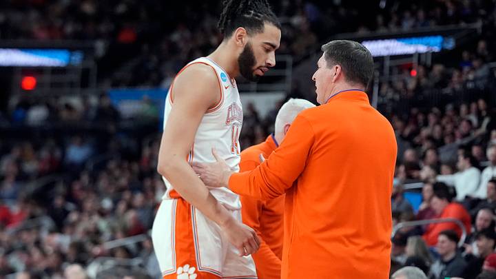 Mar 20, 2025; Providence, RI, USA; Clemson Tigers head coach Brad Brownell talks with Clemson Tigers center Christian Reeves (14) during the first half against the McNeese State Cowboys at Amica Mutual Pavilion. Mandatory Credit: Gregory Fisher-Imagn Images Mar 20, 2025; Providence, RI, USA; Clemson Tigers head coach Brad Brownell talks with Clemson Tigers center Christian Reeves (14) during the first half against the McNeese State Cowboys at Amica Mutual Pavilion. Mandatory Credit: Gregory Fisher-Imagn Images