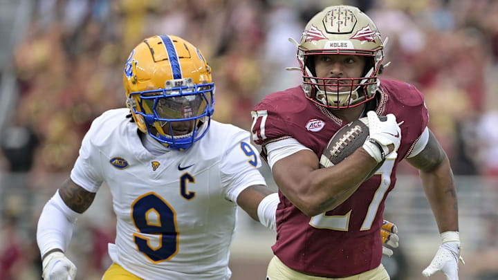 Oct 11, 2025; Tallahassee, Florida, USA; Florida State Seminoles running back Gavin Sawchuk (27) runs the ball past Pittsburgh Panthers linebacker Kyle Louis (9) during the first half at Doak S. Campbell Stadium. Mandatory Credit: Melina Myers-Imagn Images Oct 11, 2025; Tallahassee, Florida, USA; Florida State Seminoles running back Gavin Sawchuk (27) runs the ball past Pittsburgh Panthers linebacker Kyle Louis (9) during the first half at Doak S. Campbell Stadium. Mandatory Credit: Melina Myers-Imagn Images