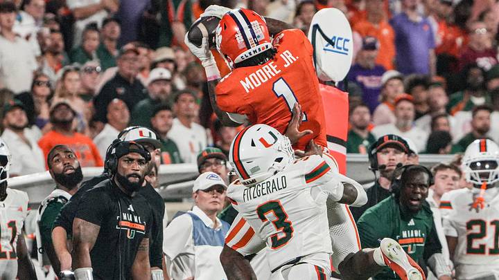Clemson wide receiver T.J. Moore (1) makes a catch near Miami Hurricanes defensive back Bryce Fitzgerald (3) during the second quarter at Memorial Stadium Saturday, October 3, 2026. Clemson wide receiver T.J. Moore (1) makes a catch near Miami Hurricanes defensive back Bryce Fitzgerald (3) during the second quarter at Memorial Stadium Saturday, October 3, 2026.