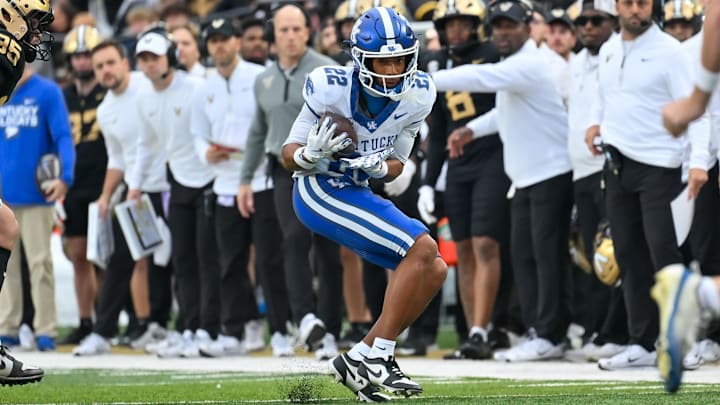 Nov 22, 2025; Nashville, Tennessee, USA;  Kentucky Wildcats wide receiver Cameron Miller (22) makes a catch against the Vanderbilt Commodores during the first half at FirstBank Stadium. Mandatory Credit: Steve Roberts-Imagn Images